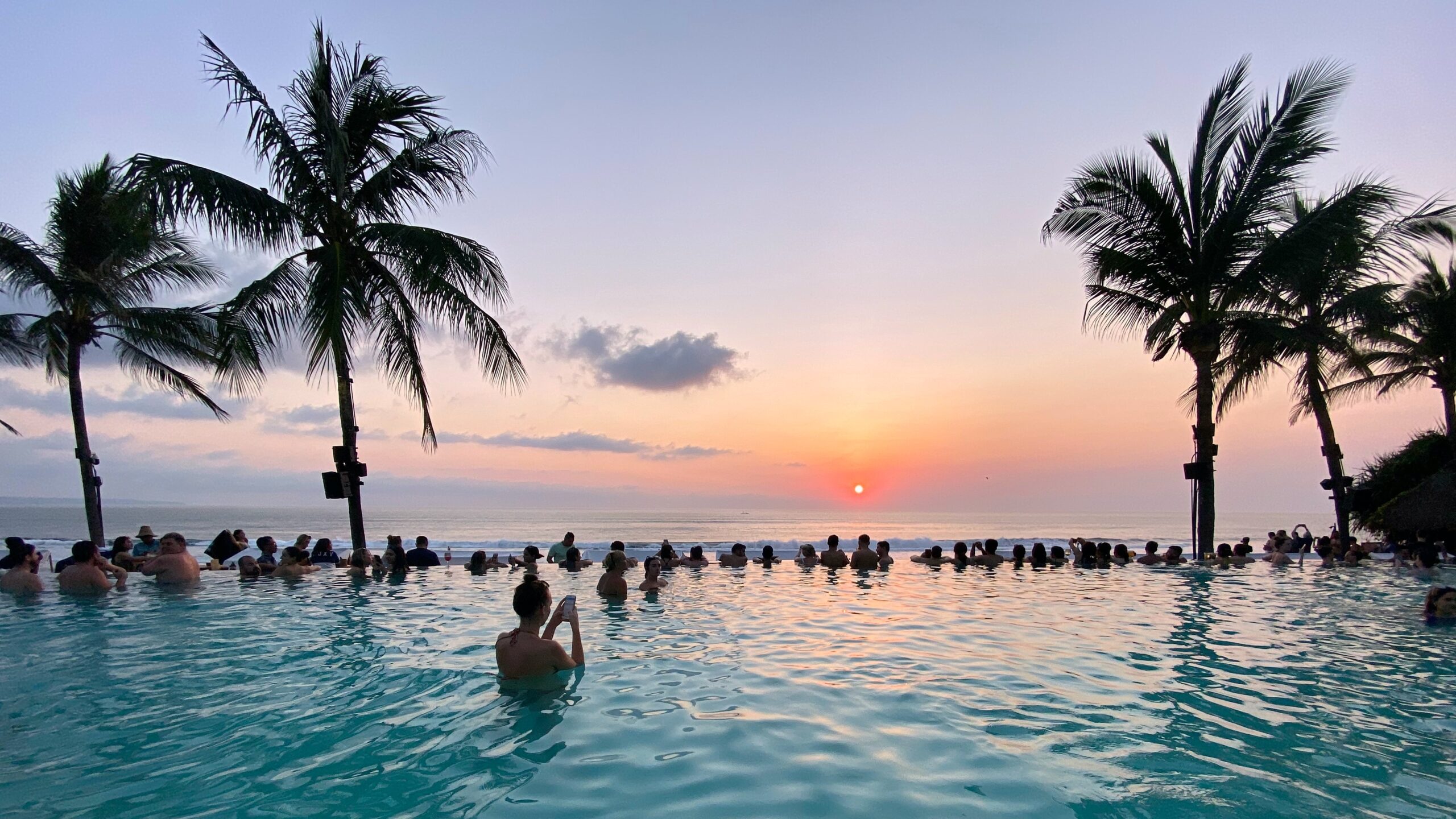 This photo is taken at the Potato Head Beach Club pool, overlooking the ocean as the sun was setting